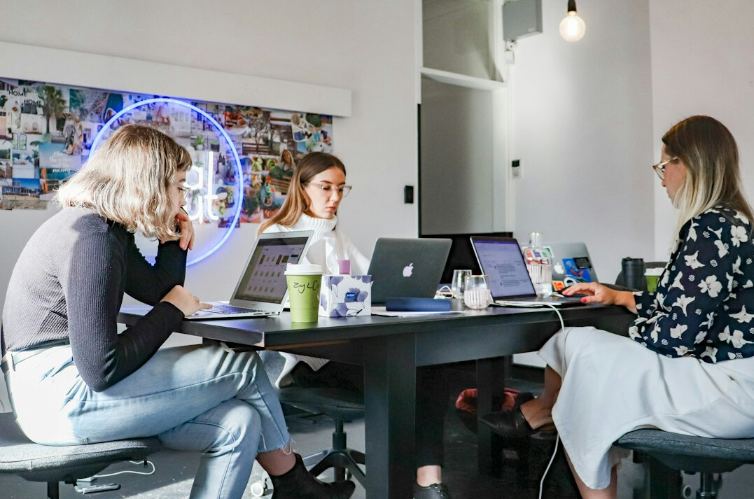 woman coding on laptop