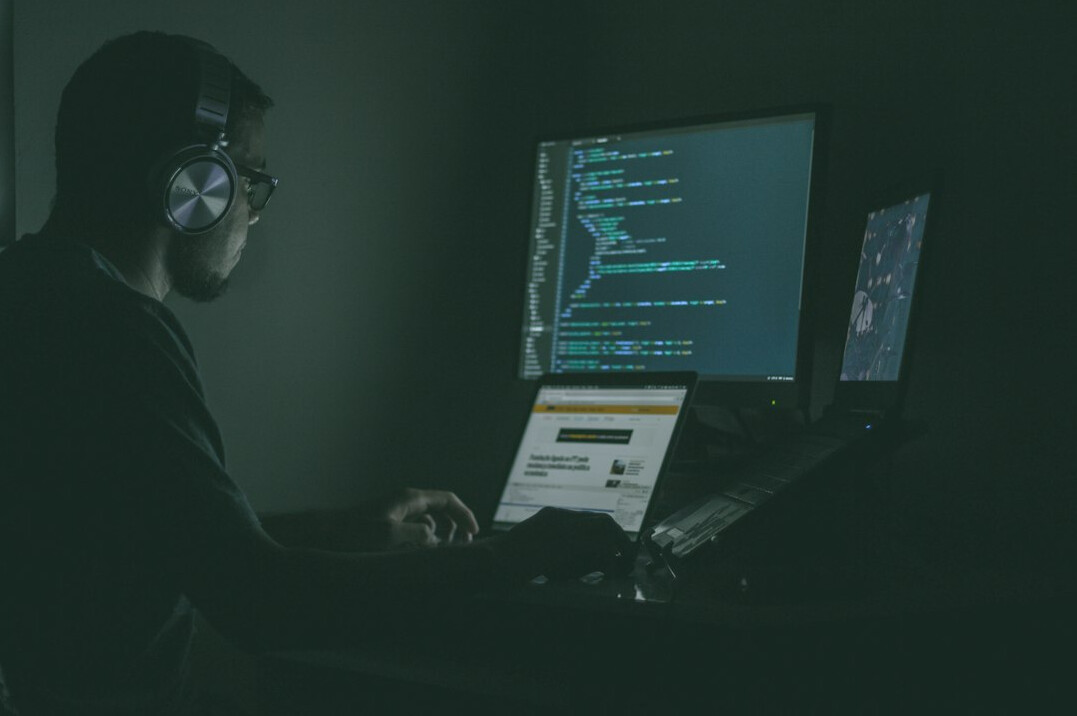 man writing code